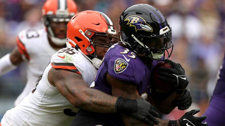 Cleveland Browns defensive tackle Jordan Elliott (90) reacts after