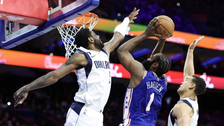 Dallas Mavericks star Kyrie Irving tries to block Philadelphia 76ers star James Harden's shot