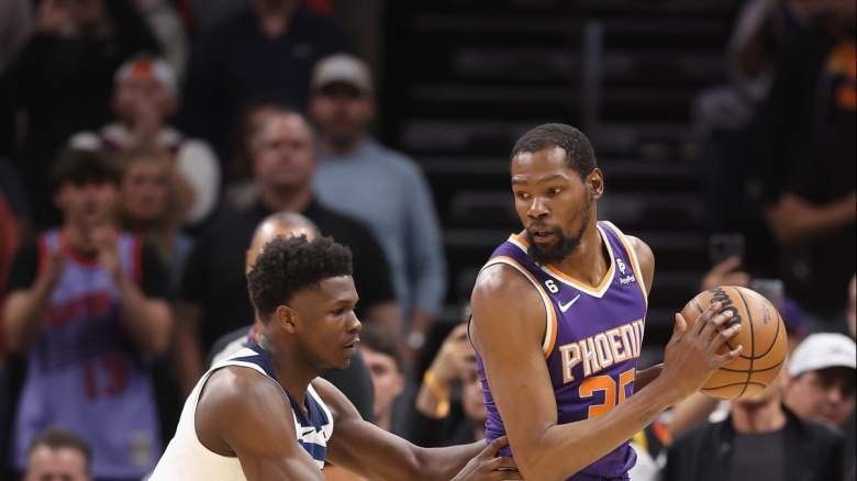 Minnesota Timberwolves guard Anthony Edwards guards Phoenix Suns forward Kevin Durant