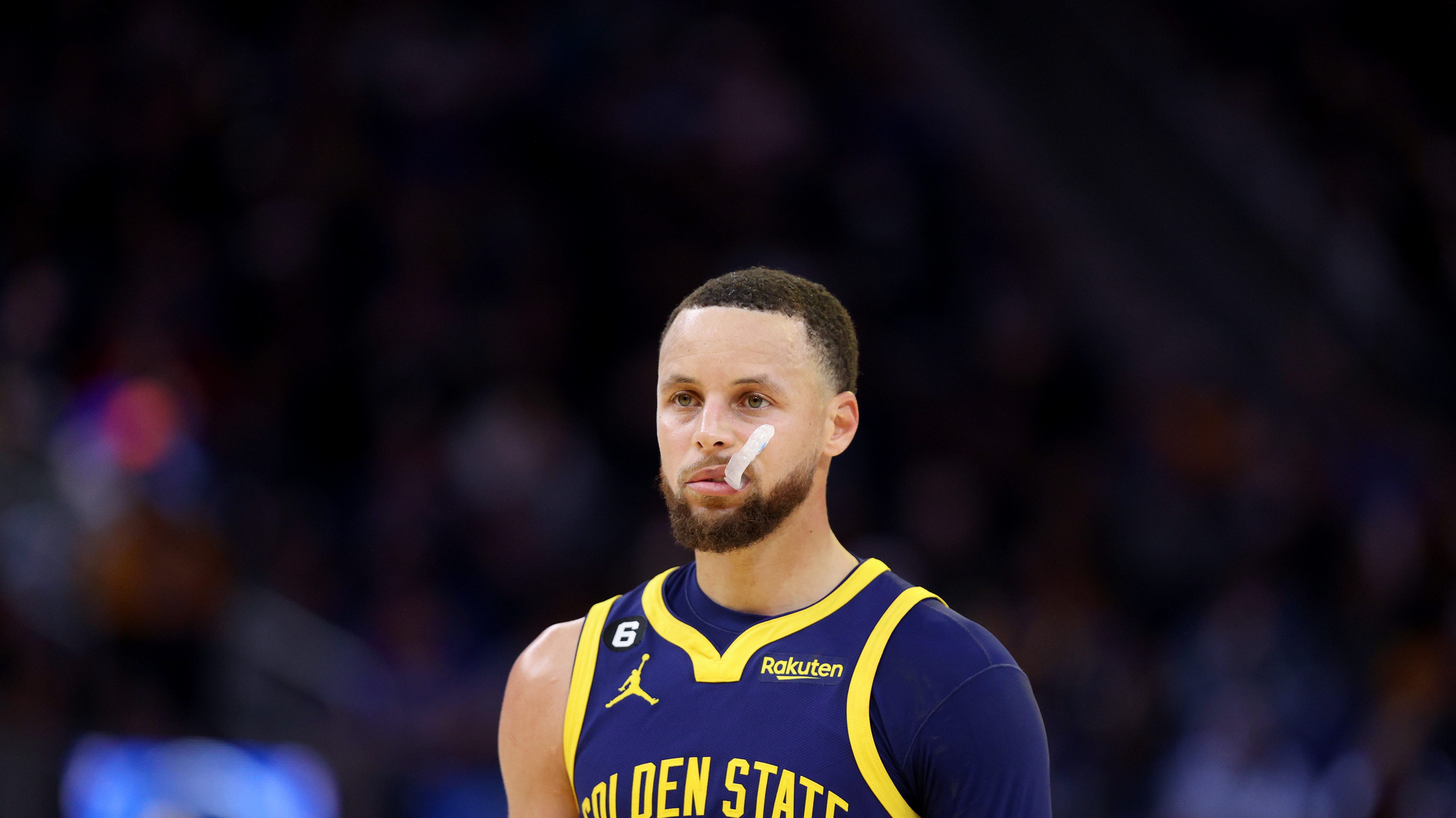 Golden State Warriors' Stephen Curry holds his All-Star game jersey