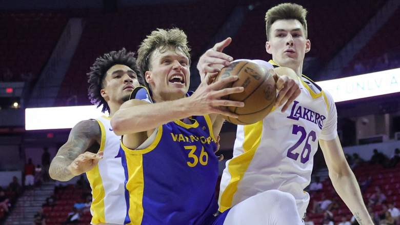 Jayce Johnson (in blue), playing for the Warriors' Summer League team in Las Vegas.