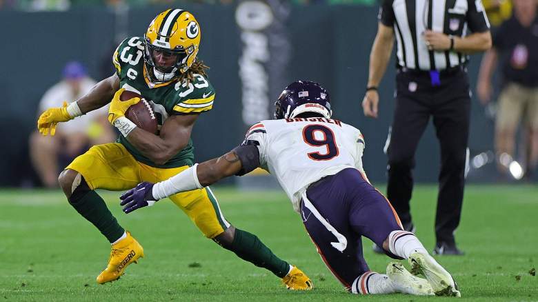 Jaquan Brisker of the Bears misses a tackle on the Packers' Aaron Jones