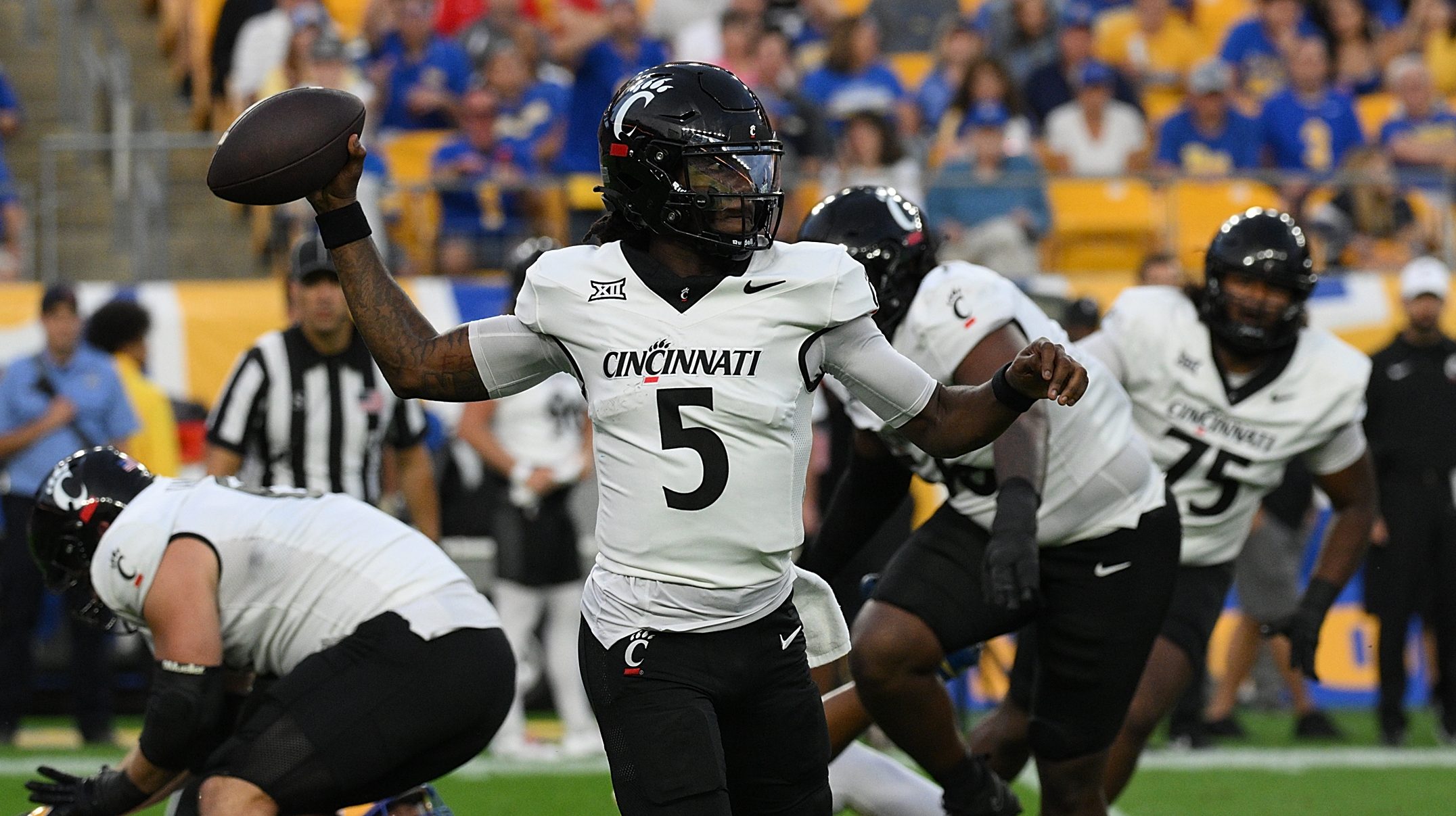 Kiner runs for 153 yards as Cincinnati holds off Pitt 27-21 in