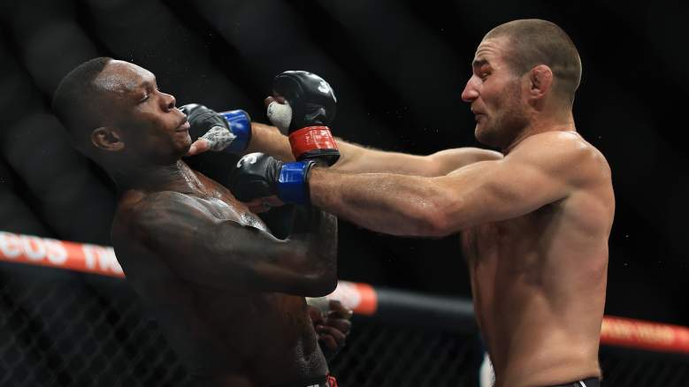 Sean Strickland punches with Israel Adesanya at UFC 293.