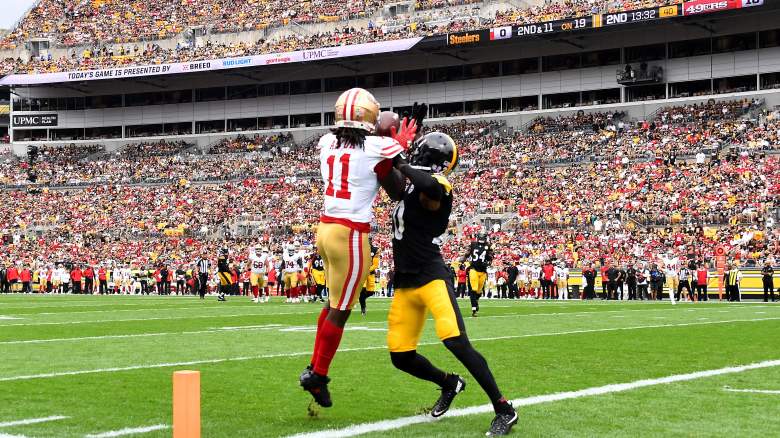 The 49ers' Brandon Aiyuk (11) makes a catch over the Steelers' Patrick Peterson.