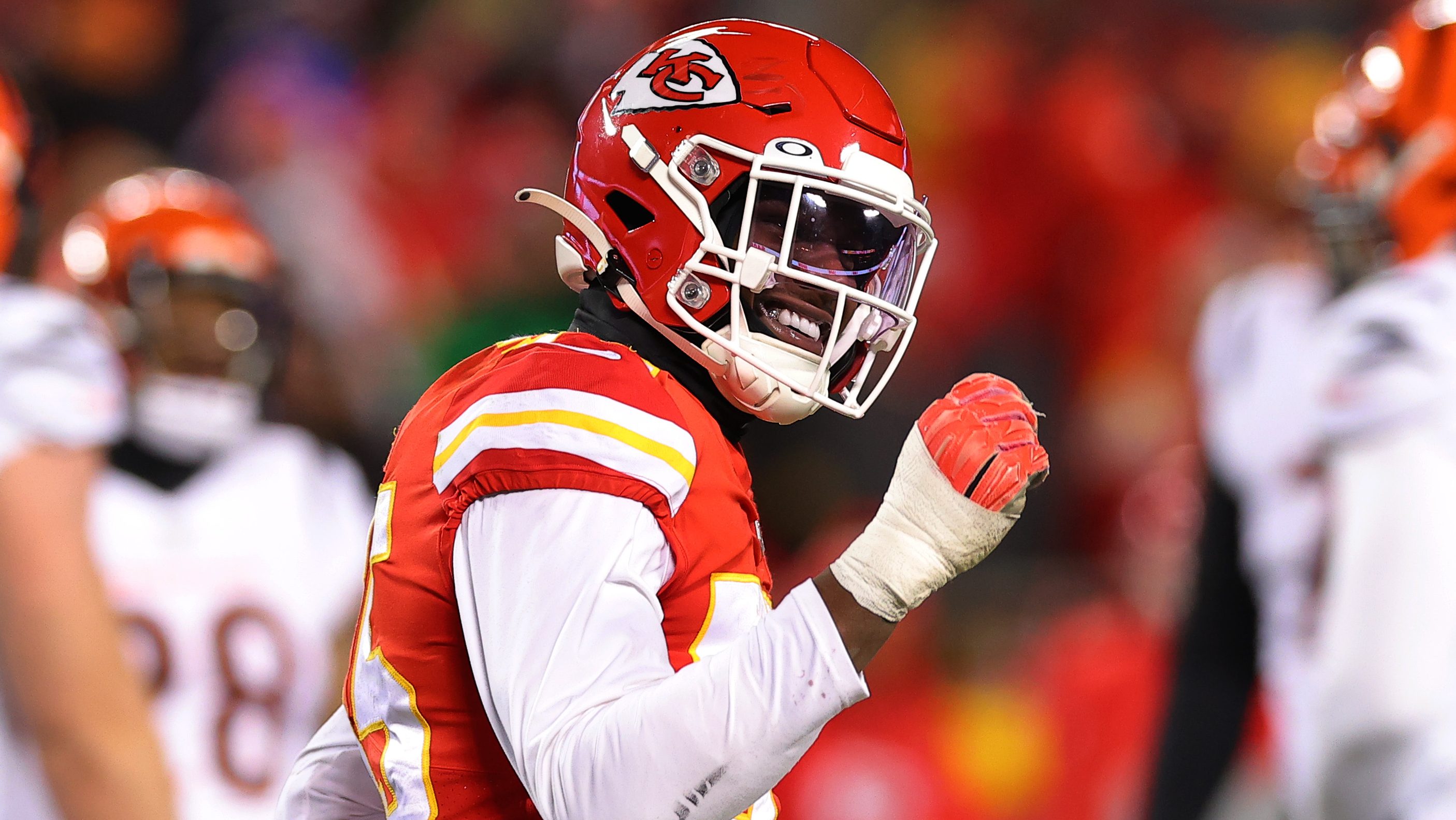 Kansas City Chiefs players, indulging running back Damien Williams (26) and  quarterback Patrick Mahomes (15) stand for the national anthem before an NFL  football game against the Tennessee Titans Sunday, Nov. 10