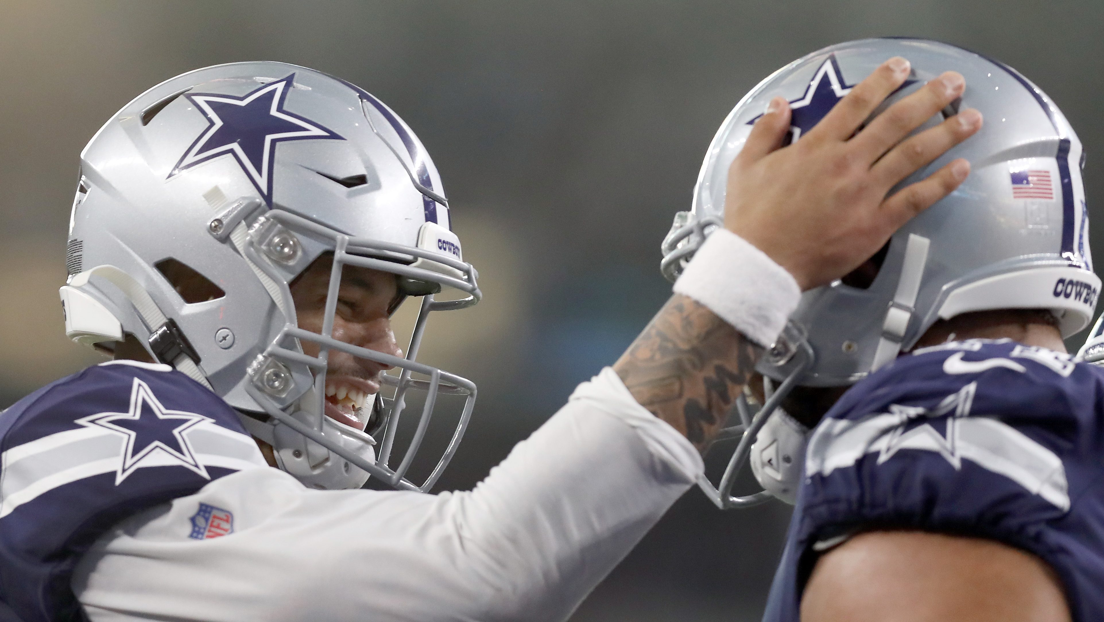 Why are Dallas Cowboys wearing red stripe on helmet vs. Broncos?