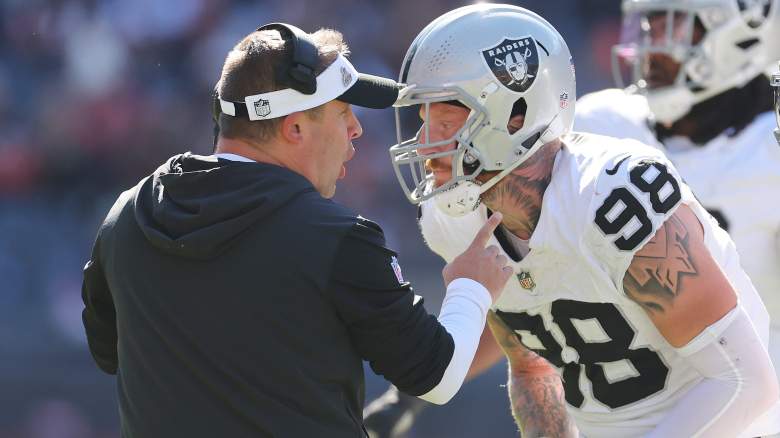 Josh McDaniels (left) and Maxx Crosby of the Raiders, who were part of a team meeting on Thursday