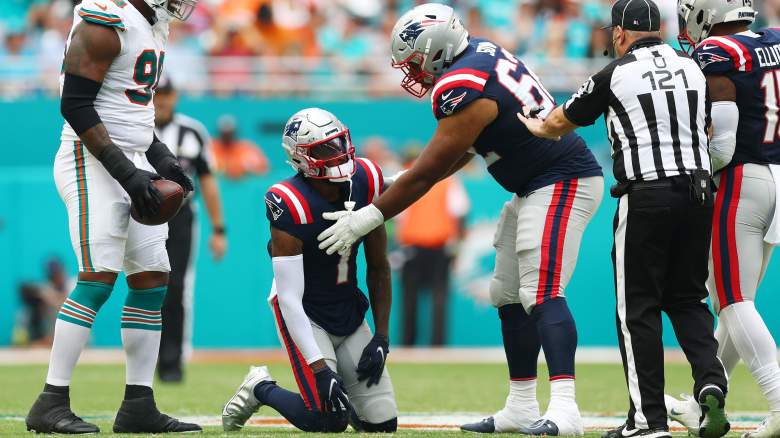 Patriots receiver DeVante Parker (on knees) took a helmet-to-helmet hit in the loss to Miami.