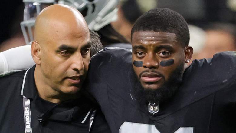 Raiders starting CB Amik Robertson is helped off the field after being kneed in the head on Sunday.