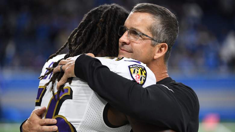 Ex-Ravens LB Josh Bynes embraces head coach John Harbaugh after win.