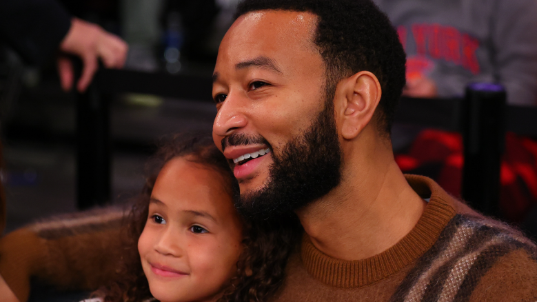John Legend and his daughter at Madison Square Garden on Christmas.