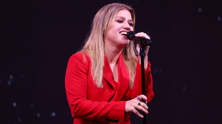 Kelly Clarkson performs on stage.