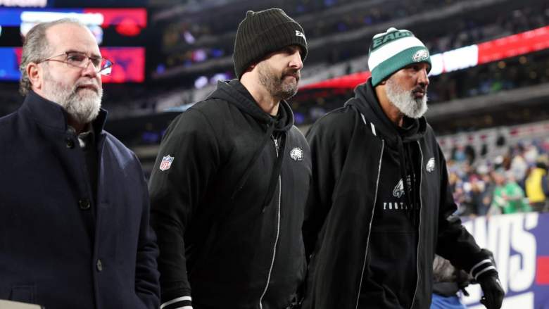 The Eagles coaching staff walks off the field defeated.