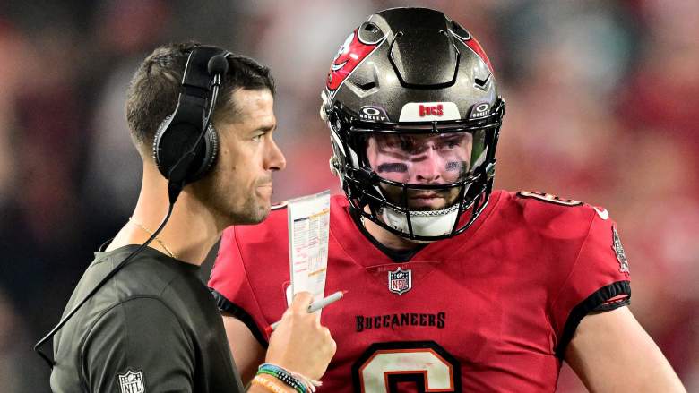 The Buccaneers' Baker Mayfield (right) could be replaced by Russell Wilson should he leave Tampa.