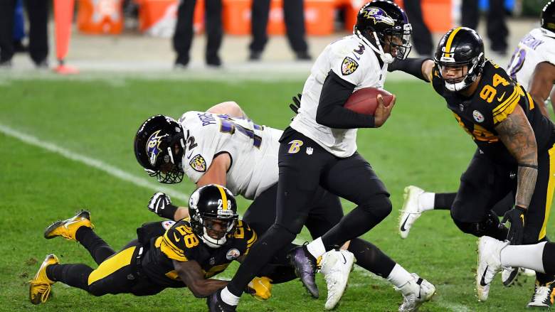 Ex-Ravens QB Robert Griffin III evades sack with his legs against Steelers.