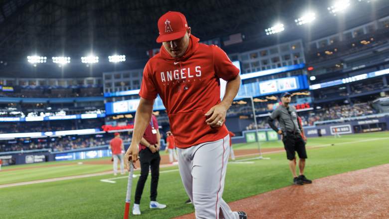 Angels OF Mike Trout jogging off field in game against Blue Jays.