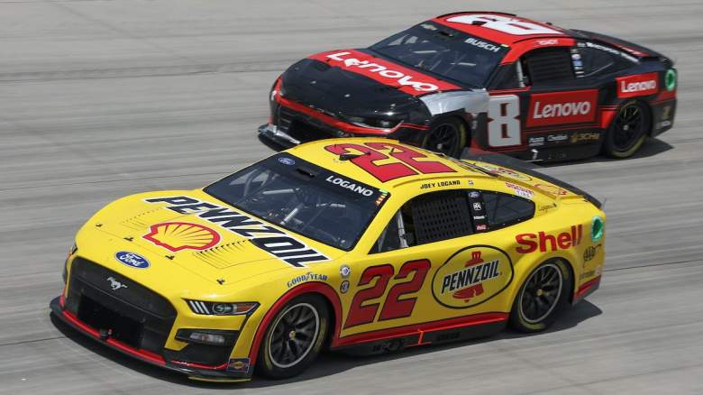 Joey Logano and Kyle Busch race at Dover.