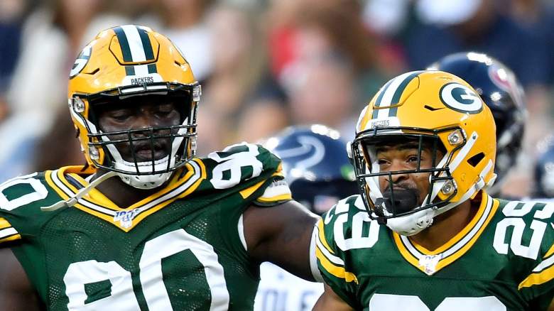 GREEN BAY, WISCONSIN - AUGUST 08: Montravius Adams #90 and Ka'dar Hollman #29 of the Green Bay Packers celebrate after Hollman made an interception in the first quarter against the Houston Texans during a preseason game at Lambeau Field on August 08, 2019 in Green Bay, Wisconsin. (Photo by Quinn Harris/Getty Images)