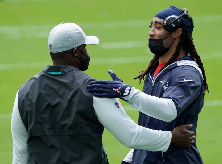 Stephon Gilmore and Brian Flores