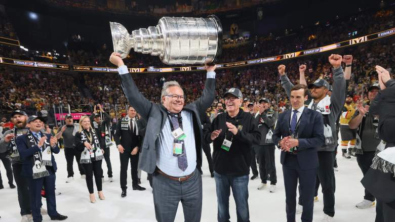 General manager Kelly McCrimmon of the Vegas Golden Knights hoists the Stanley Cup in 2023