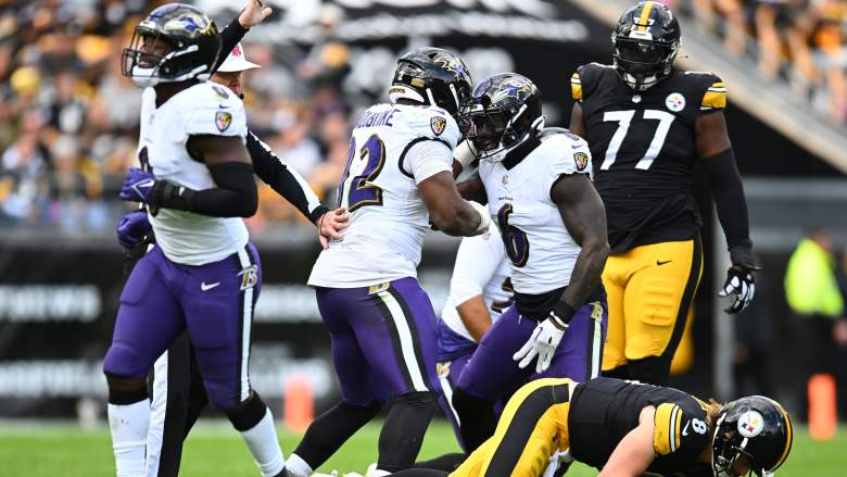 Ravens LB Patrick Queen and DT Justin Madubuike celebrate sacking Steelers QB Kenny Pickett.