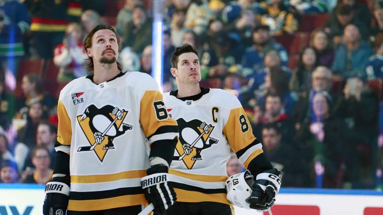 Pittsburgh Penguins players Erik Karlsson and Sidney Crosby