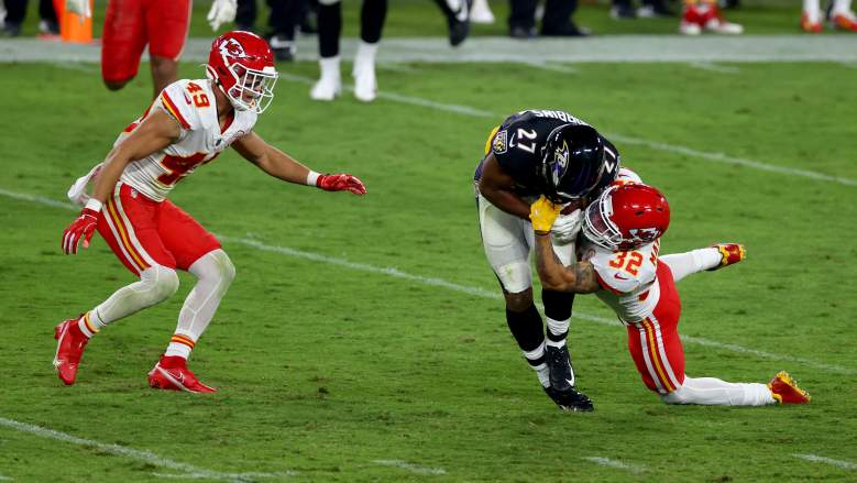 Ravens RB J.K. Dobbins is tackled by a pair of Chiefs during his rookie season.