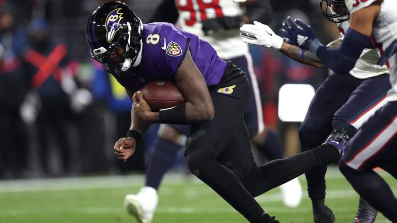 Ravens QB Lamar Jackson scores a rushing touchdown against Texans in playoffs.