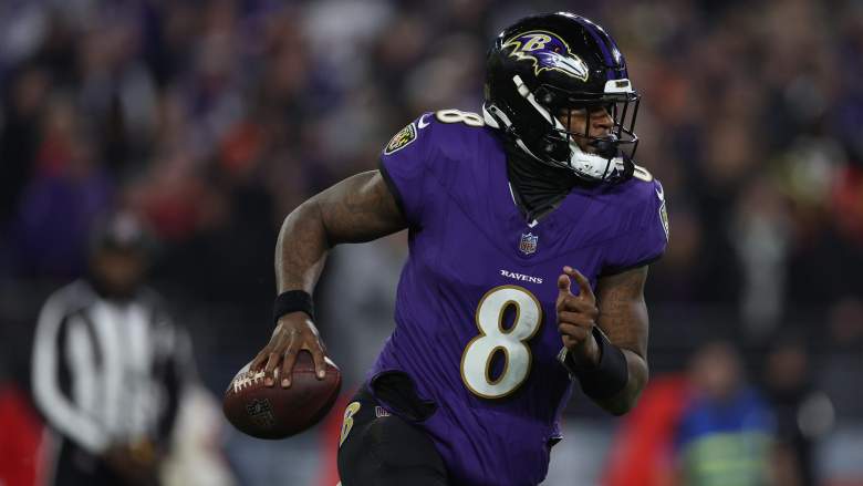 Ravens QB Lamar Jackson evades a tackle in AFC Championship game against the Chiefs.