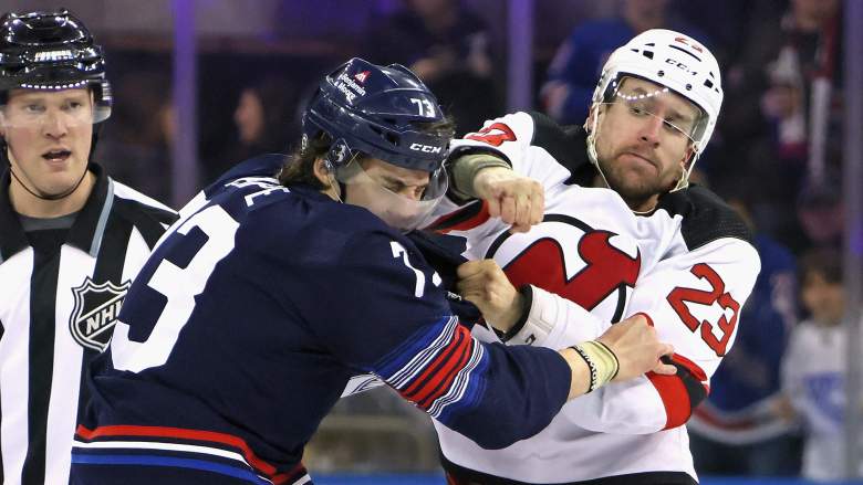 Kurtis MacDermid of the New Jersey Devils fights with Matt Rempe of the New York Rangers