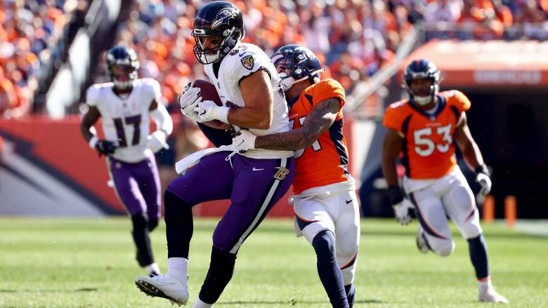 Broncos safety Justin Simmons tackles Ravens TE Mark Andrews.