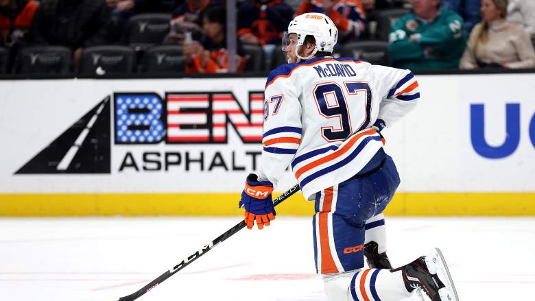 Edmonton Oilers' Connor McDavid was cross-checked by Cannucks' Nikita Zadorov and Carson Soucy.