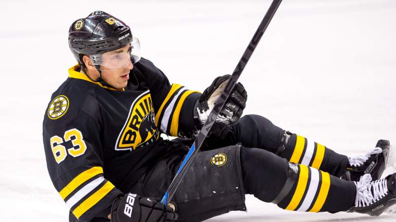 Boston Bruins captain Brad Marchand left Game 3 and it's possible Panthers' Sam Bennett punched him in the head.