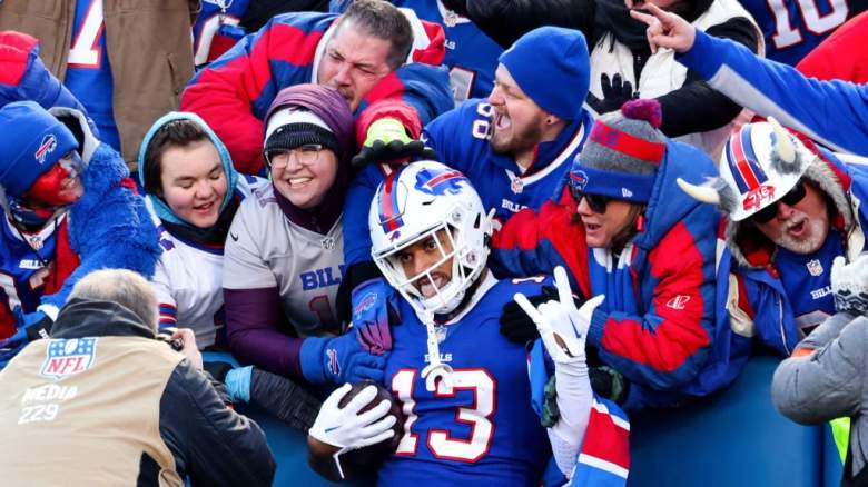 A Buffalo Bills player celebrates with fans after catching a TD pass.