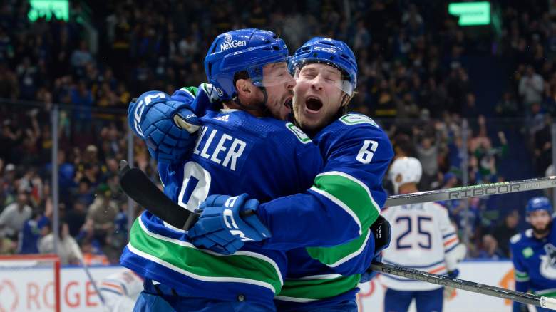 Vancouver Canucks players celebrate a goal.