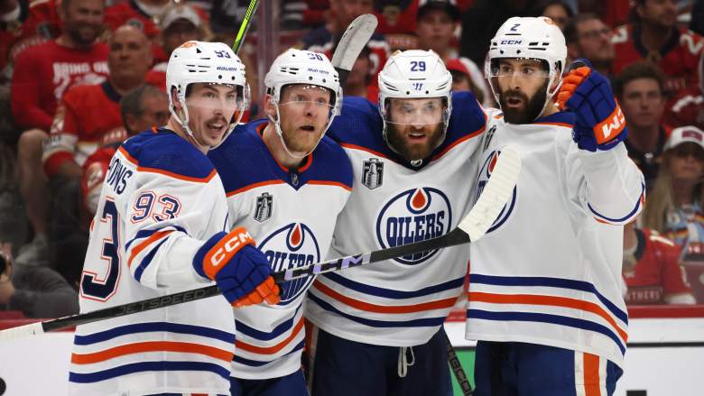 Edmonton Oilers players celebrate a goal.