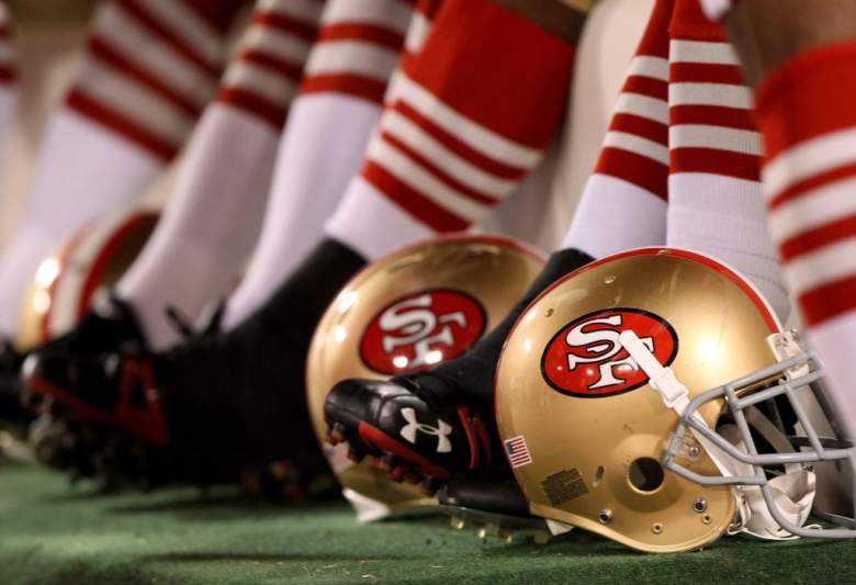 Two 49ers helmets on the field before an NFL game.