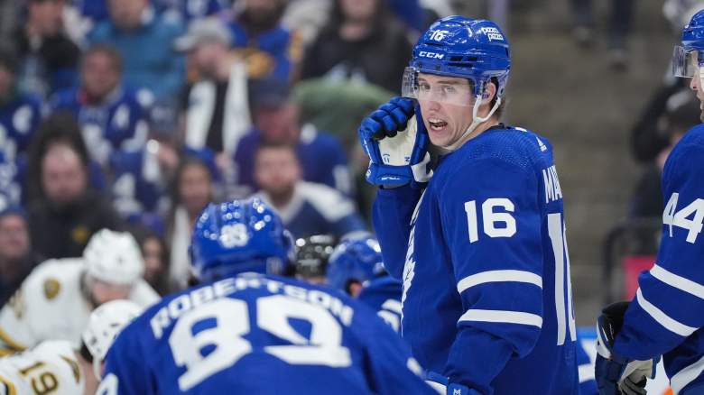 Maple Leasf' Nick Robertson speaks to Mitch Marner.