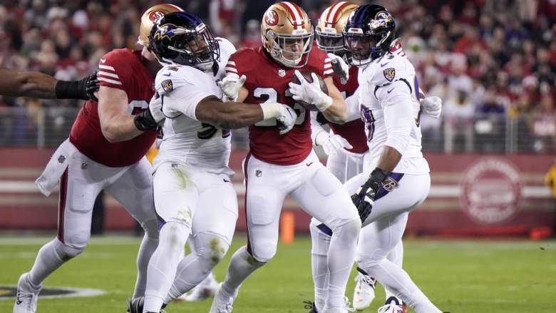 Justin Madubuike and Christian McCaffrey