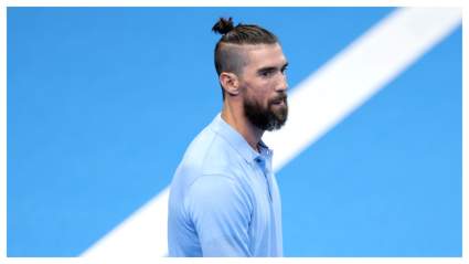 Michael Phelps’ ‘Silly’ Man Bun Causes Waves as He Watches Simone Biles Compete