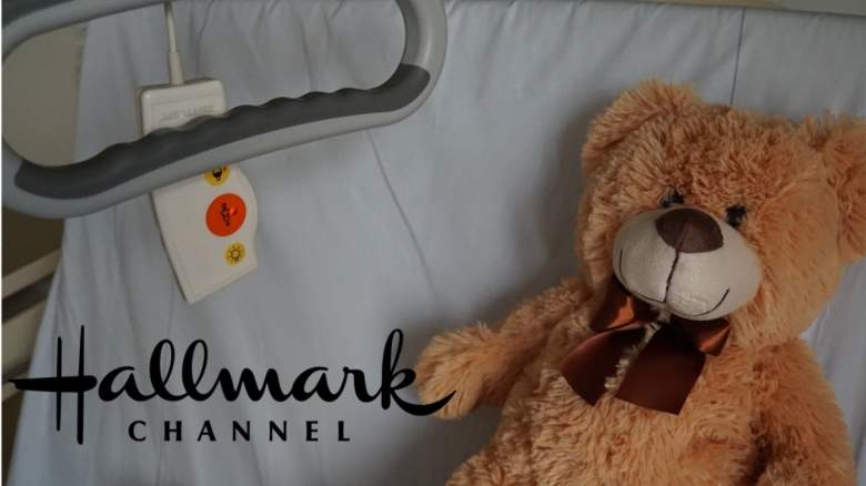 A teddy bear in a hospital bed.