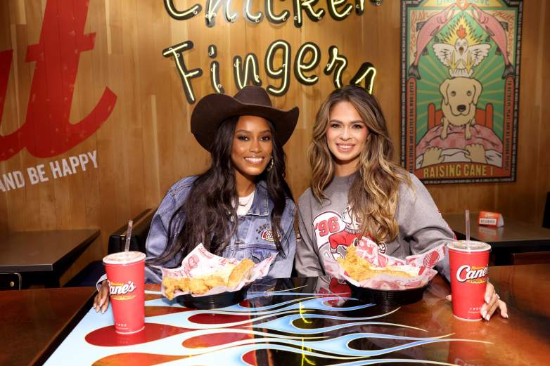 Ciara Miller and Kelsey Anderson pose together in front of their meals.