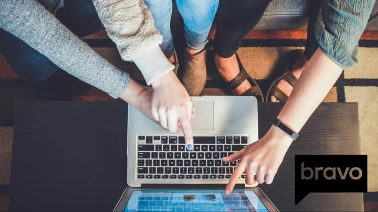 Women pointing at a laptop.