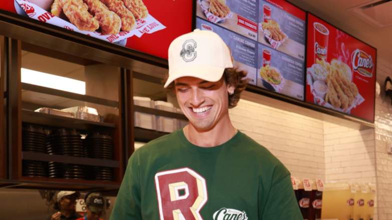 Sam Hurley serves meal at the Raising Cane's Times Square location.