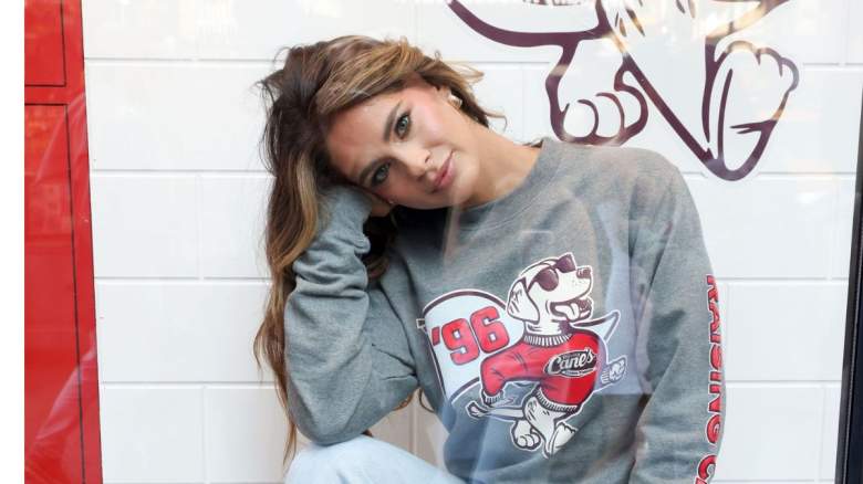 Kelsey Anderson poses in the window of Raising Cane's Times Square location.