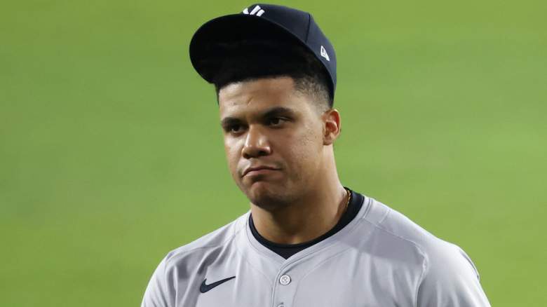 Juan Soto with cap coming off head