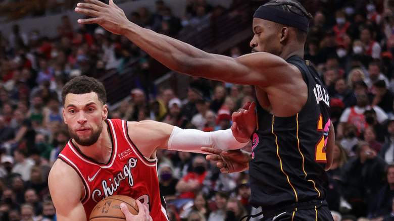 Zach Lavine (l) pushes off Jimmy Butler.