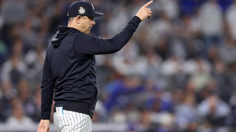 Yankees manager Aaron Boone signals to tghe bullpen