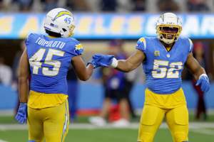 Chargers LB Tuli Tuipulotu (#45) and LB Khalil Mack (#52)